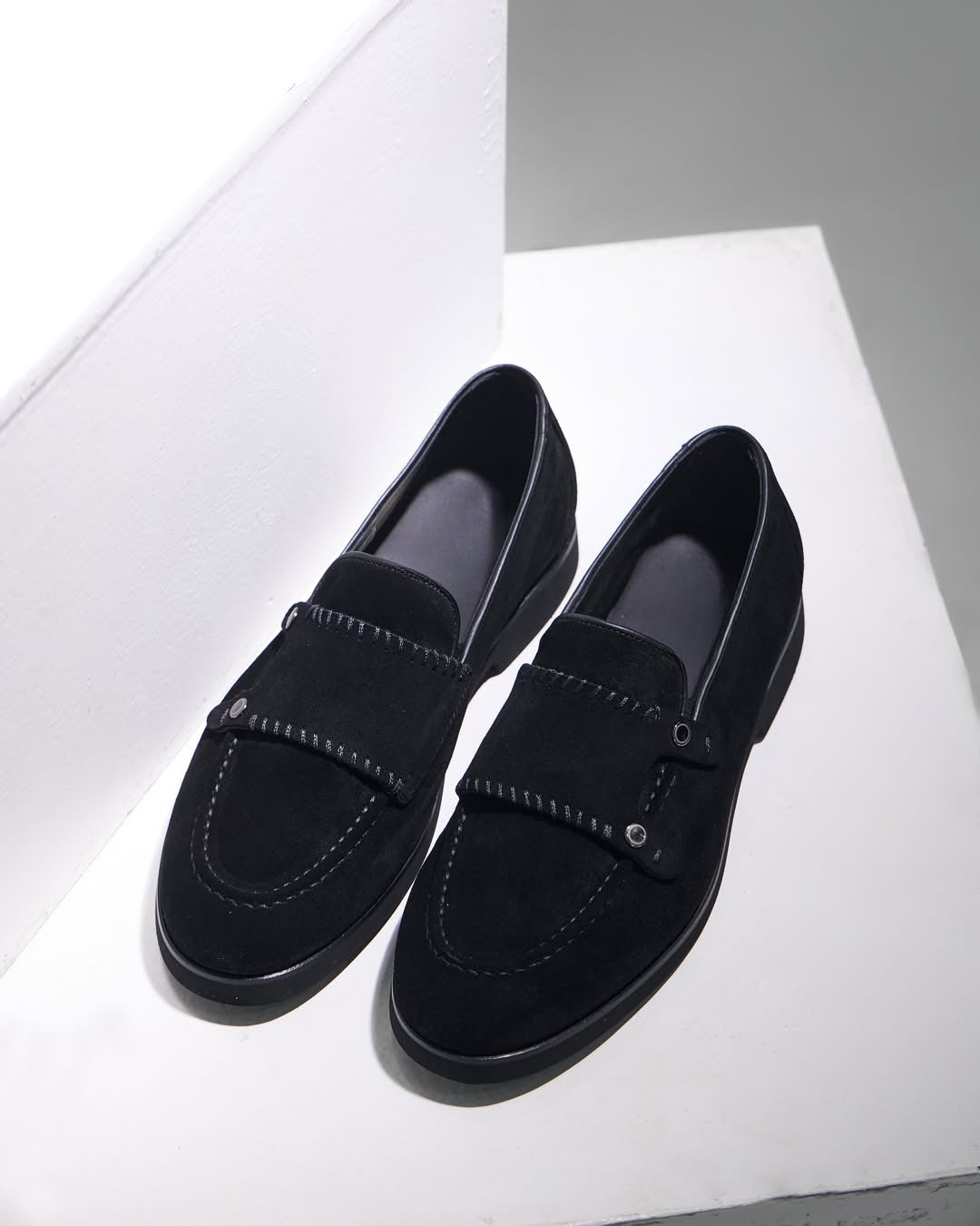 Black suede slip-on shoes